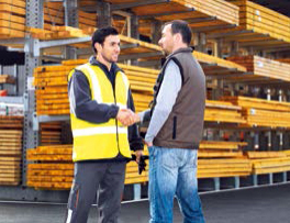 Employee and customer in warehouse