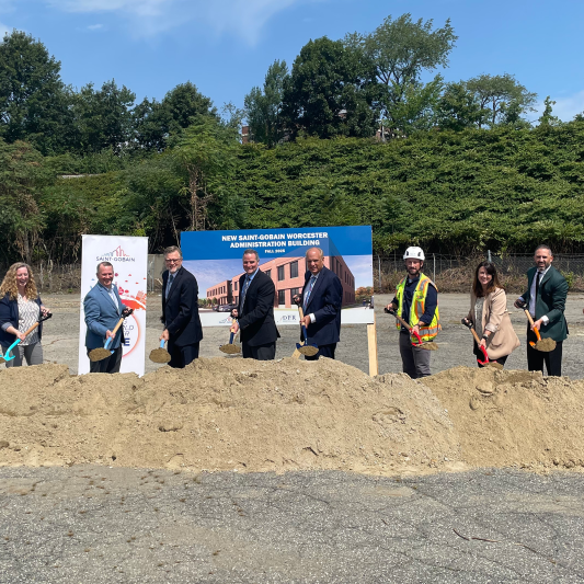 men and women with shovels 