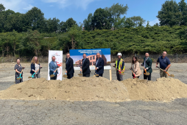 men and women with shovels 