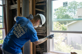 A construction worker actively engaged on-site, representing sustainability efforts in the construction industry.