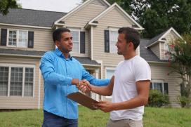 Contractor and homeowner shaking hands