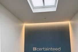 An LED skylight mimics the outdoor sky in the stairwell at the Malvern Innovation Center for Saint-Gobain CertainTeed